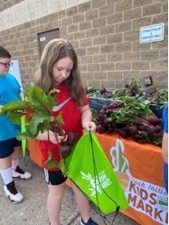 Elementary students receive fresh produce